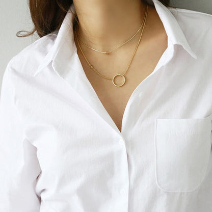 Chemise unie à manches longues en tissu premium